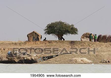 Stock Photography - People in pirogues (small boats) fishing in the Niger River between Mopti and Lake Debo, Mali. Fotosearch