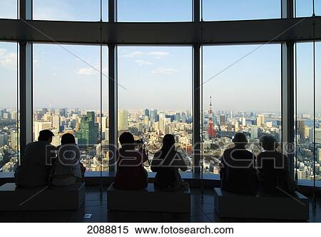 Stock Photography - People In Silhouette Watching The Tokyo Tower From The Observation Deck Of Rappongi Hills; Tokyo, Japan. Fotosearch