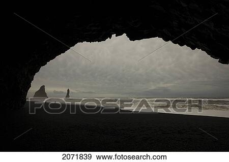 People In The Distance On A Black Sand Beach With Storm Clouds Above, Near Vik, Iceland View Large Photo Image Stock Photo - People In The Distance On A Black Sand Beach With Storm Clouds Above, Near Vik, Iceland. Fotosearch