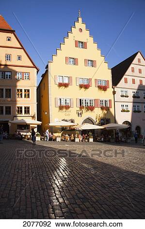 Stock Image - People In The Marketplace And Buildings With Peaked Roofs; Rothenburg Ob Der Tauber Bavaria Germany. Fotosearch