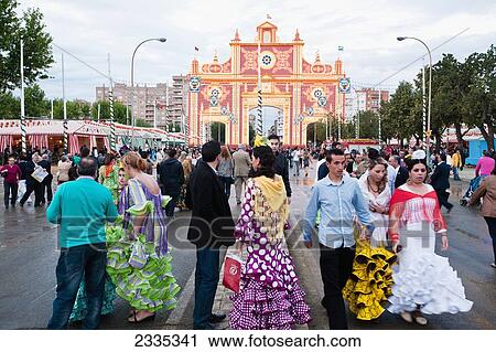 People In Traditional Dresses During April Feria Festival; Seville, Andalucia, Spain View Large Photo Image Stock Image - People In Traditional Dresses During April Feria Festival; Seville, Andalucia, Spain. Fotosearch