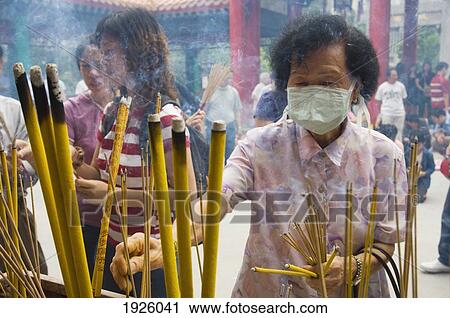 People Lighting Up Incense Sticks View Large Photo Image Stock Image - People Lighting Up Incense Sticks. Fotosearch