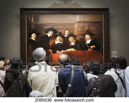Stock Photograph - People Looking At A Picture In A Museum. Fotosearch