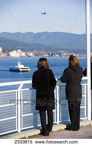 People Looking At View, Vancouver Waterfront, Harbor; Vancouver, British Columbia, Canada View Large Photo Image Stock Photography - People Looking At View, Vancouver Waterfront, Harbor; Vancouver, British Columbia, Canada. Fotosearch