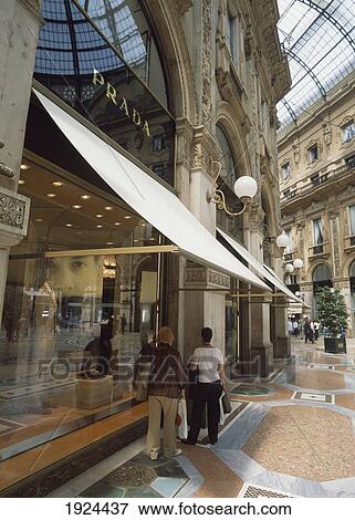 Stock Photo - People Looking In Windows Of Shop. Fotosearch