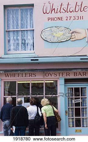 People Looking Into Wheeler's Oyster Bar In Whitstable, Kent, England, United Kingdom View Large Photo Image Stock Image - People Looking Into Wheeler's Oyster Bar In Whitstable, Kent, England, United Kingdom. Fotosearch