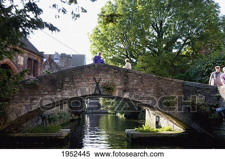 People on a bridge over a canal, Bruges (Brugge), West Flanders, Belgium View Large Photo Image Stock Photography - People on a bridge over a canal, Bruges (Brugge), West Flanders, Belgium. Fotosearch