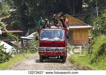 Stock Photo - People on a truck, Sereale, Toraja Land, South Sulawesi, Indonesia. Fotosearch