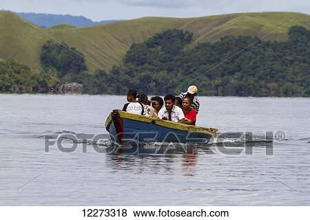 People on board a boat on Lake Sentani, Papua, Indonesia View Large Photo Image Stock Photo - People on board a boat on Lake Sentani, Papua, Indonesia. Fotosearch