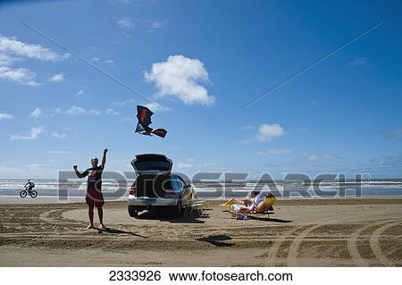 Stock Photograph - People On Casino Beach; Rio Grande Do Sul, Brazil. Fotosearch