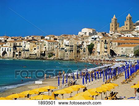 Stock Image - People On Cefalu Beach. Fotosearch