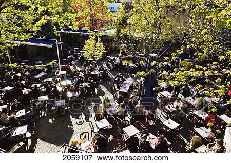 Stock Photo - People On Terrace Saint-Sulpice, Quartier Latin, Montreal, Quebec. Fotosearch