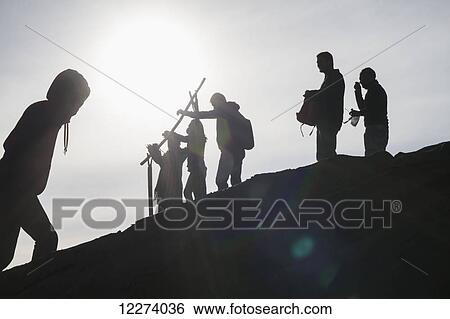 Stock Photograph - People on the rim of the crater of Mount Bromo, Bromo Tengger Semeru National Park, East Java, Indonesia. Fotosearch