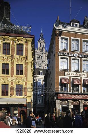 People Outside Cafes With Steeple Visible Between Two Buildings View Large Photo Image Stock Photo - People Outside Cafes With Steeple Visible Between Two Buildings. Fotosearch