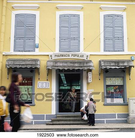 Stock Image - People Outside Portugese Style Chemist. Fotosearch