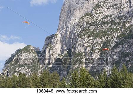 Stock Photo - People Paragliding, Fie Allo Sciliar; Alto Adige, Italy. Fotosearch