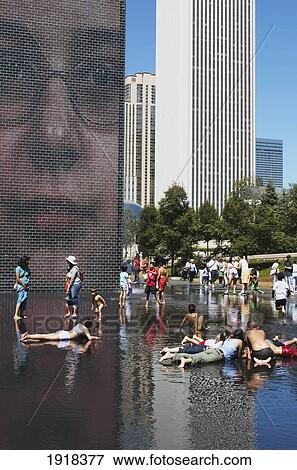 People Playing In Crown Fountain At Millenium Park, Chicago, Illinois, Usa View Large Photo Image Stock Photo - People Playing In Crown Fountain At Millenium Park, Chicago, Illinois, Usa. Fotosearch