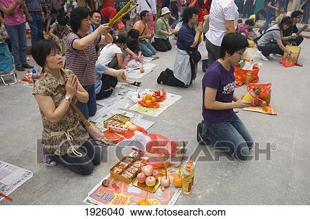 People Praying Kneeling On Pavement View Large Photo Image Stock Image - People Praying Kneeling On Pavement. Fotosearch