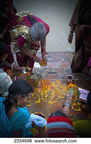 Stock Photo - People Preparing Colorful Paint For Holi Celebration; Varanasi, India. Fotosearch