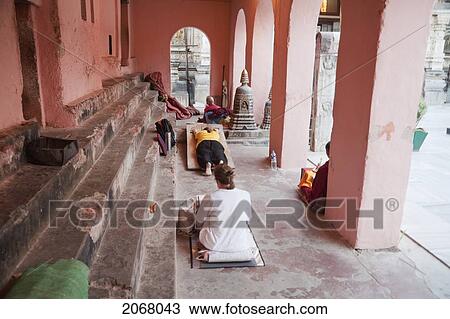 Stock Image - People Prostrating, Mahabodi Temple, Bodhgaya, Bihar, India. Fotosearch
