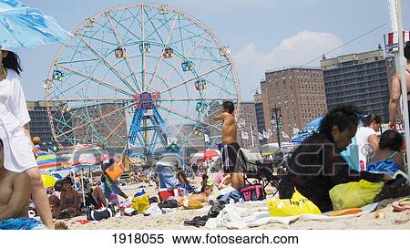 People Relaxing At The Beach At Coney Island In Brooklyn, New York, Usa View Large Photo Image Stock Photography - People Relaxing At The Beach At Coney Island In Brooklyn, New York, Usa. Fotosearch