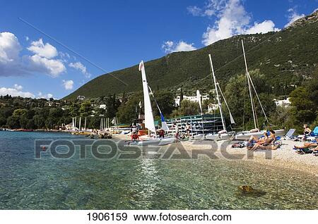 Stock Photo - People Relaxing On Beach, Lefkas, Ionian Islands, Greece. Fotosearch