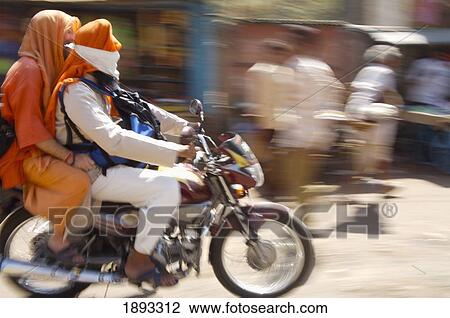 People Riding Motorcycle In Street View Large Photo Image Stock Image - People Riding Motorcycle In Street. Fotosearch