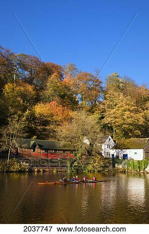 People Sitting In A Boat Along The Shoreline; Durham England View Large Photo Image Stock Photo - People Sitting In A Boat Along The Shoreline; Durham England. Fotosearch