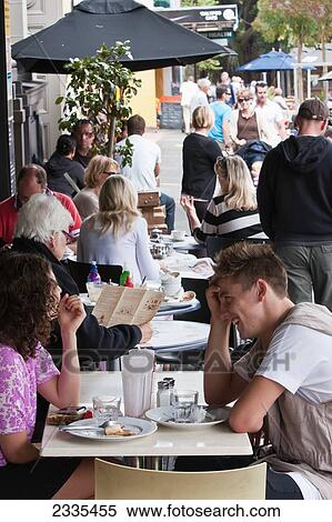 Stock Photography - People Sitting In Sidewalk Cafe; New Zealand. Fotosearch