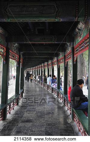 People Sitting On A Ledge And Pedestrians Along A Walkway; Beijing China View Large Photo Image Stock Photo - People Sitting On A Ledge And Pedestrians Along A Walkway; Beijing China. Fotosearch