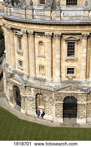 Stock Image - People Sitting Outside Radcliffe Camera; Oxford, England. Fotosearch