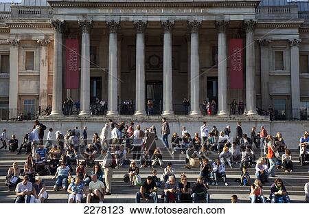 People sitting outside the National Gallery, Trafalgar Square; London, England View Large Photo Image Stock Image - People sitting outside the National Gallery, Trafalgar Square; London, England. Fotosearch