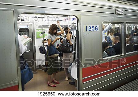 People Standing In The Tokyo Subway; Tokyo, Japan View Large Photo Image Stock Image - People Standing In The Tokyo Subway; Tokyo, Japan. Fotosearch