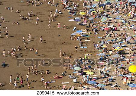 Stock Photography - People Sunbathing At Itzurun Beach, Zumaia, Basque Country, Spain. Fotosearch
