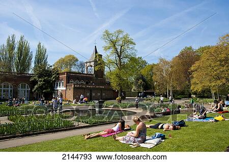 People Sunbathing On A Spring Day In Holland Park, West London, London, Uk View Large Photo Image Stock Image - People Sunbathing On A Spring Day In Holland Park, West London, London, Uk. Fotosearch