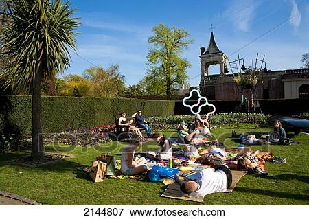 People Sunbathing On A Spring Day In Holland Park, West London, London, Uk View Large Photo Image Stock Photo - People Sunbathing On A Spring Day In Holland Park, West London, London, Uk. Fotosearch