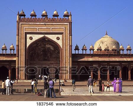 Stock Photograph - People Visiting Jami Masjid Mosque At The 16Th Century City Fatehpur Sikri; Uttar Pradesh, India. Fotosearch