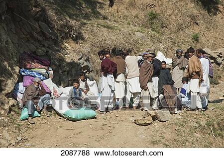 People Waiting For Aid After The 8 October 2005 Earthquake On The Sudhangali To Chikar Road, Azad Kashmir, Pakistan View Large Photo Image Stock Photo - People Waiting For Aid After The 8 October 2005 Earthquake On The Sudhangali To Chikar Road, Azad Kashmir, Pakistan. Fotosearch