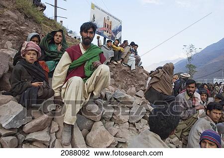 Stock Image - People Waiting For Aid And Relief Goods Near The Line Of Control, Chakothi, Azad Kashmir, Pakistan. Fotosearch