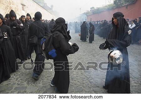 Picture - People Waiving Incense Burners During The Holy Burial Procession On Good Friday In Antigua Guatemala, Sacatep. Fotosearch