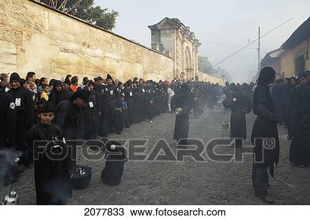 Stock Image - People Waiving Incense Burners During The Holy Burial Procession On Good Friday In Antigua Guatemala, Sacatep. Fotosearch
