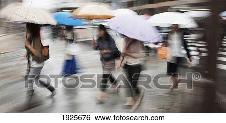 People Walking Across A Street With Umbrellas; Tokyo, Japan View Large Photo Image Stock Photograph - People Walking Across A Street With Umbrellas; Tokyo, Japan. Fotosearch