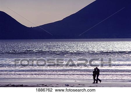 People Walking Along Beach In Silhouette View Large Photo Image Stock Image - People Walking Along Beach In Silhouette. Fotosearch