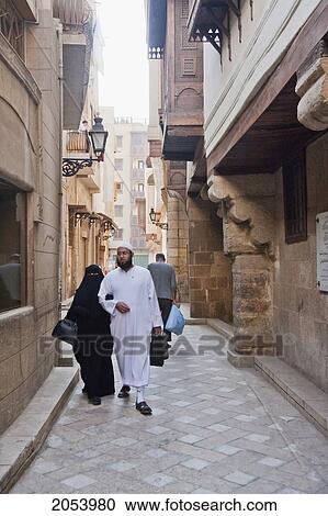 Stock Image - People Walking By Beit El-Suhaymi, A 16Th And 17Th-Century Ottoman House, Cairo, Al Qahirah, Egypt. Fotosearch
