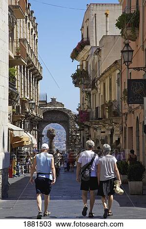 People Walking Down The Street Corso Umberto In Porto Di Messina; Taormina, Sicily, France View Large Photo Image Stock Image - People Walking Down The Street Corso Umberto In Porto Di Messina; Taormina, Sicily, France. Fotosearch