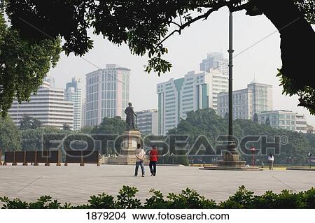 Picture - People Walking In Park Near Guangzhou Business District. Fotosearch