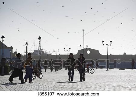 Stock Photo - People Walking In The Main Square Of Place Moulay Hassan, Essaouria, Morocco. Fotosearch
