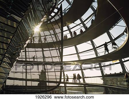Stock Photograph - People Walking Inside Reichstag Dome. Fotosearch