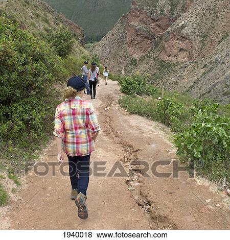 People Walking On A Path In Sacred Valley; Maras Peru View Large Photo Image Stock Photo - People Walking On A Path In Sacred Valley; Maras Peru. Fotosearch