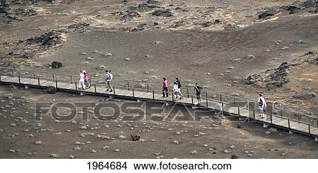 Picture - People Walking On A Wooden Boardwalk; Bartolome Island Galapagos Equador. Fotosearch
